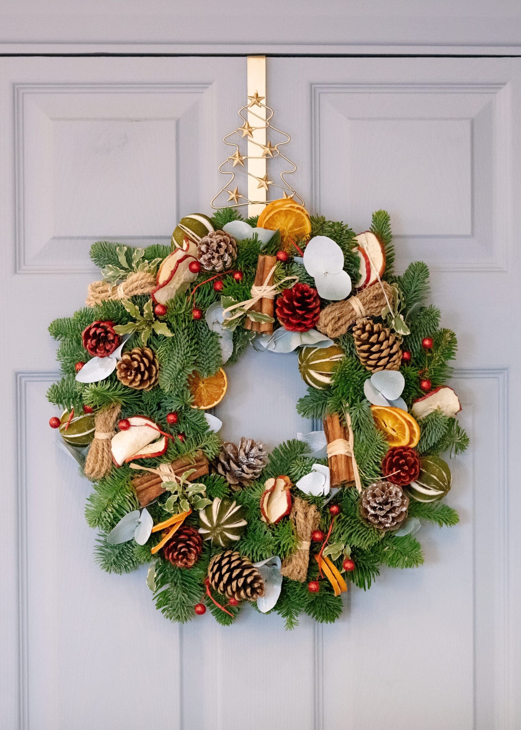 green and brown pine cone wreath